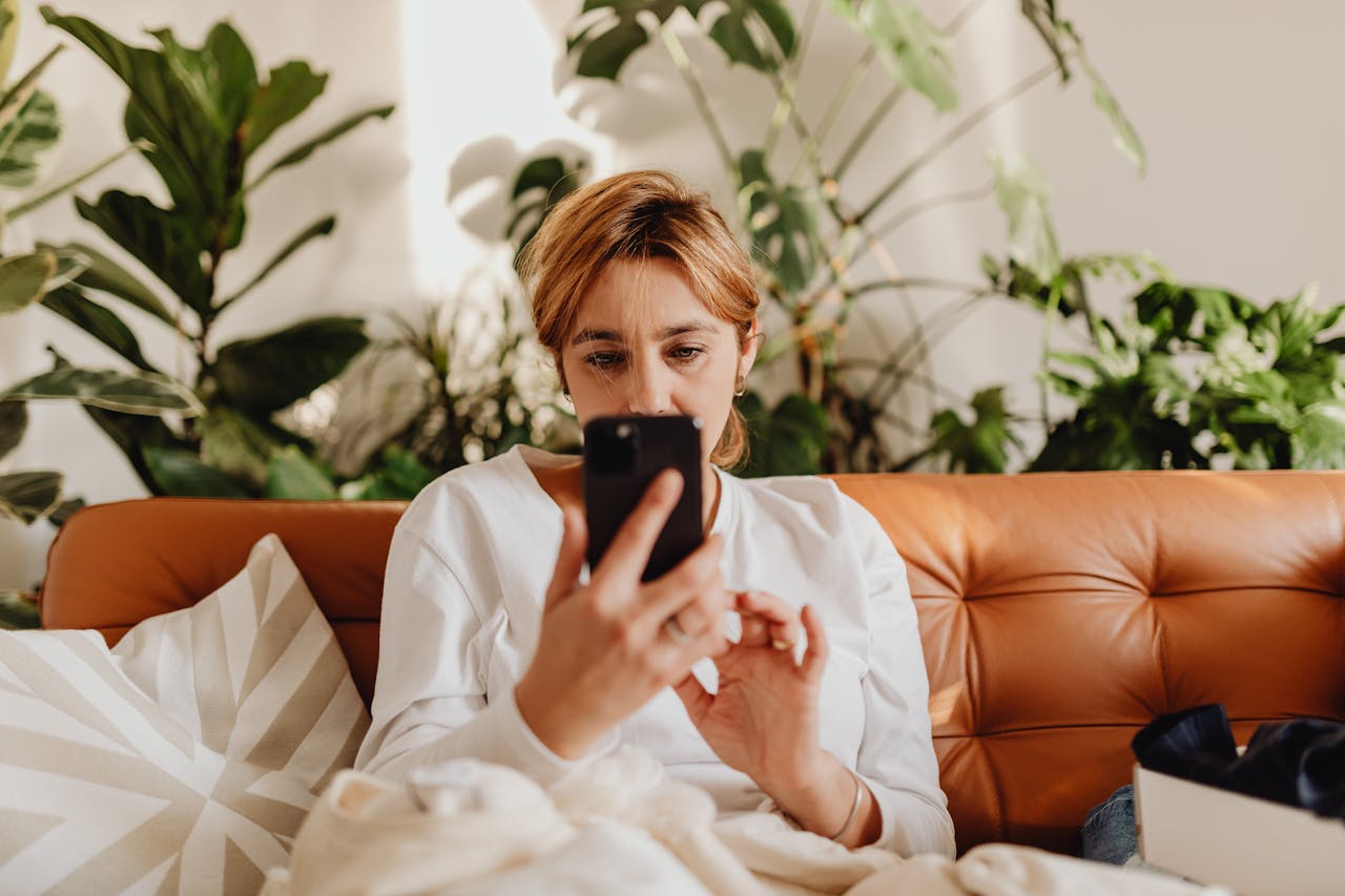 woman scrolls on phone